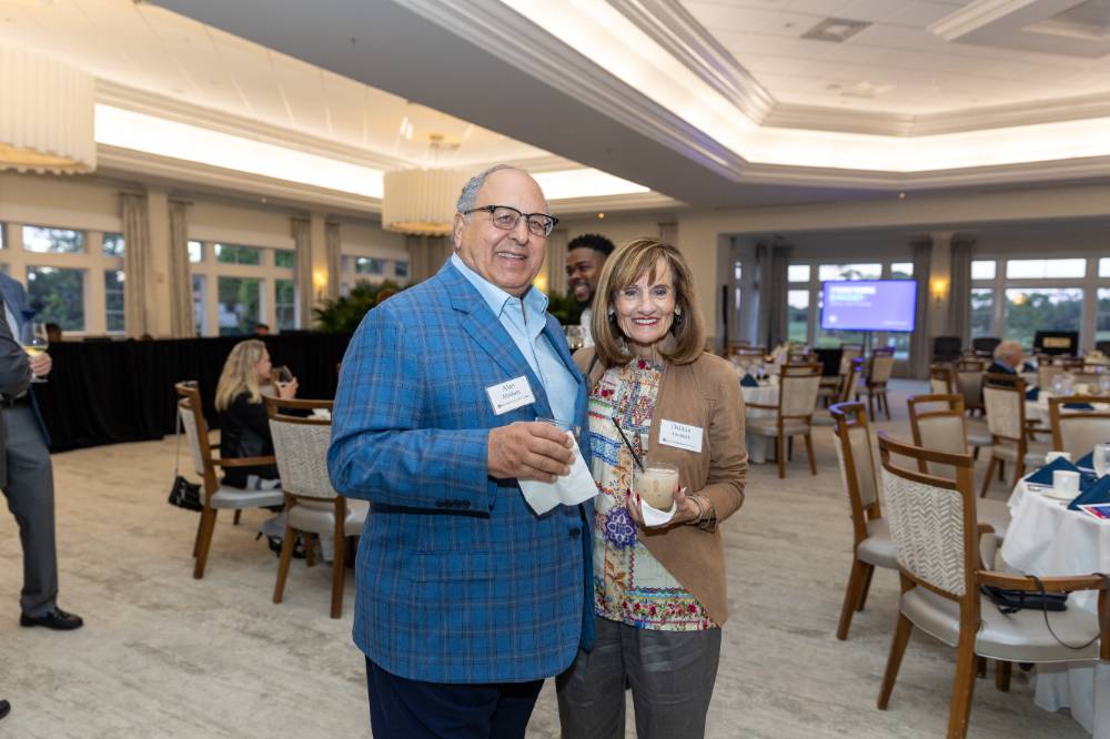 Alan and Debbie Abraham smiling at camera